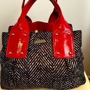 Kate Spade black and white fabric with red patent leather handles